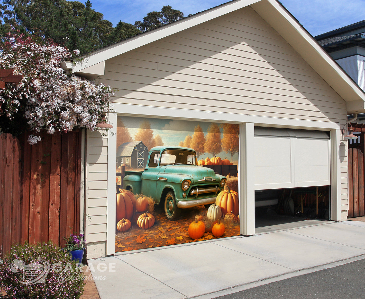 Garage door with a decorative design of a vintage truck and pumpkins.