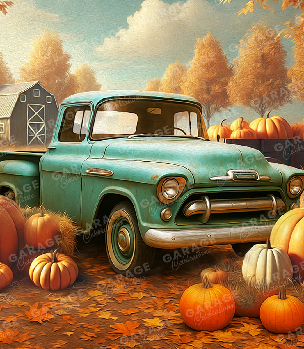 Vintage teal truck in a pumpkin patch with a barn in the background.