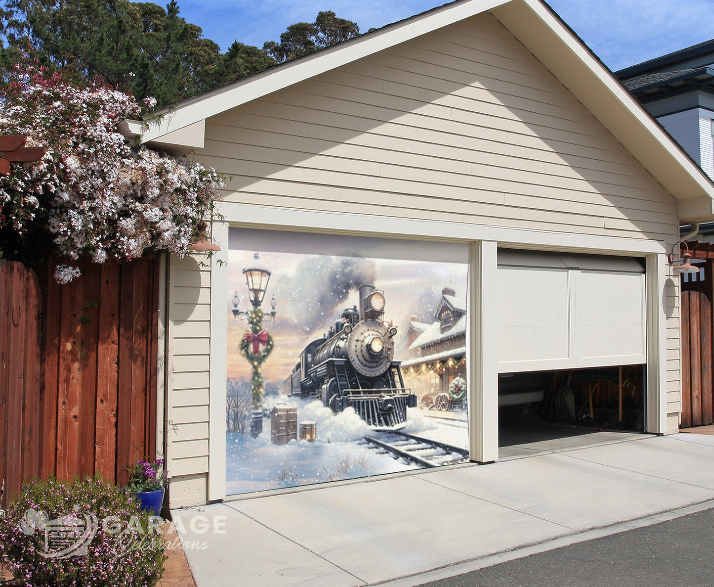 Garage door with a decorative mural of a steam train and village scene.