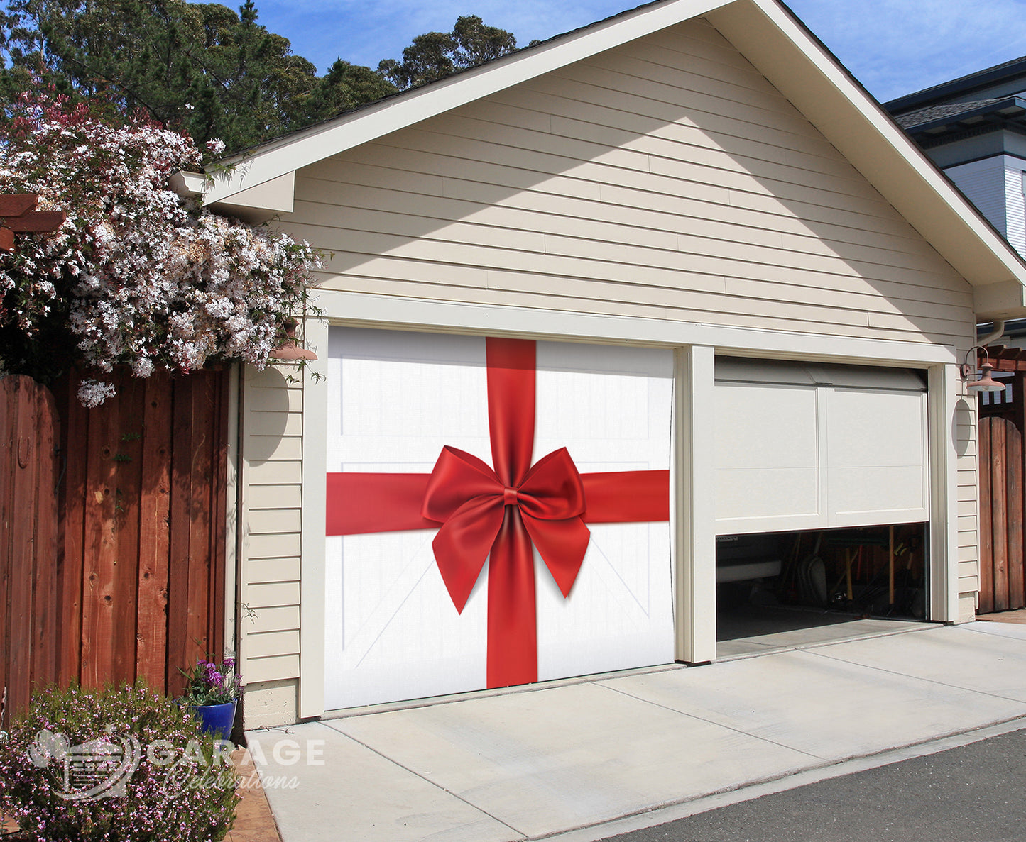 Garage door with large red ribbon with a bow on a white farmhouse garage door background.