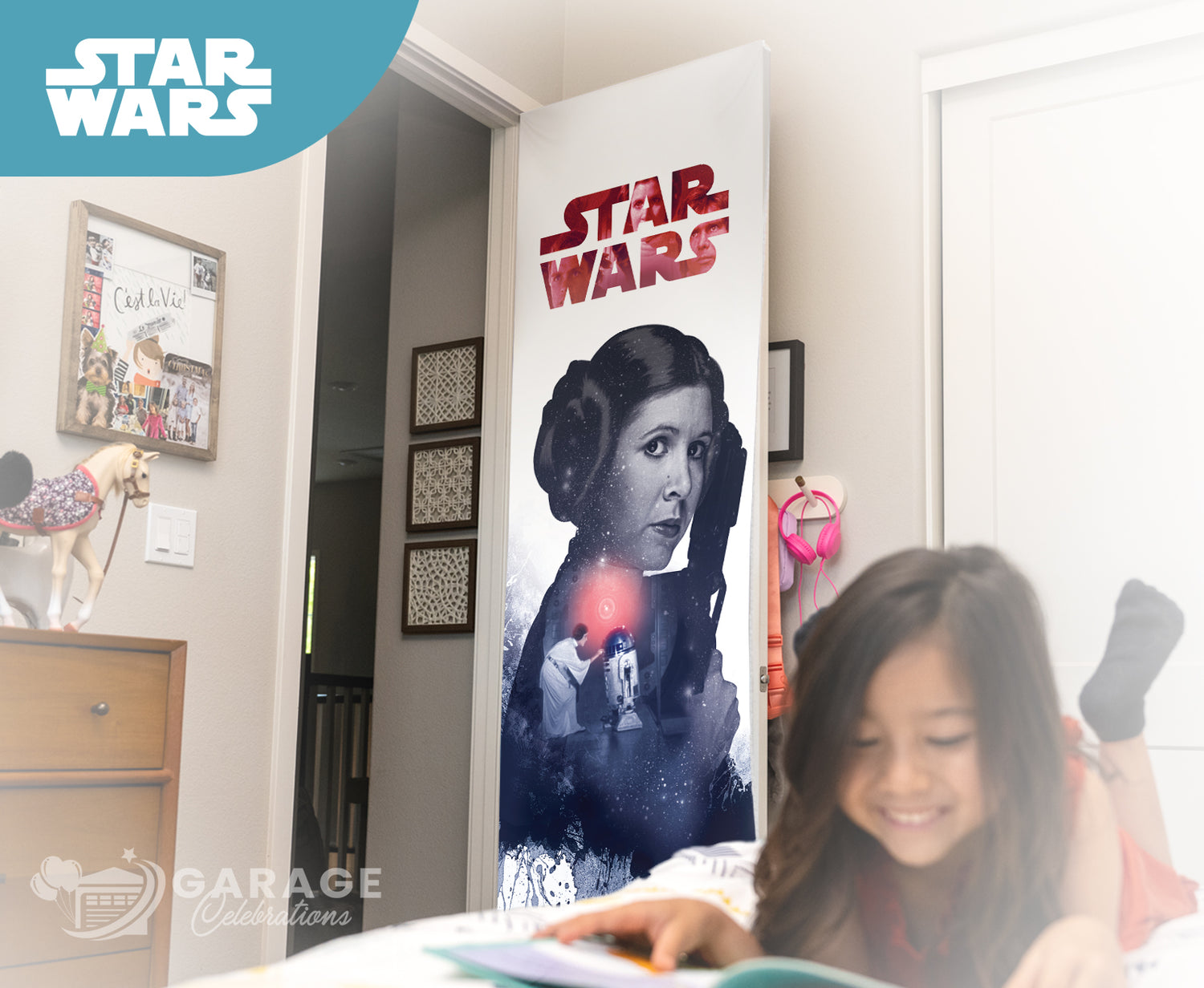 Child reading a book in a room with a Star Wars poster on the wall.