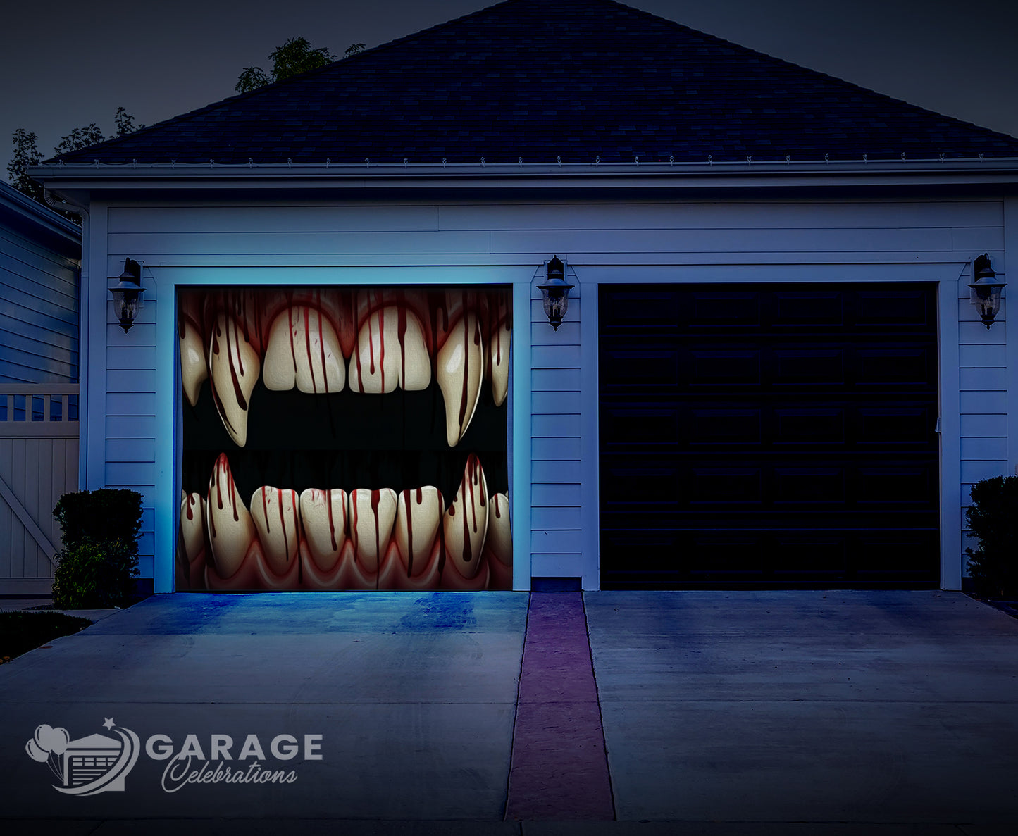 Garage door with a Halloween-themed design of vampire teeth, illuminated by blue lights.