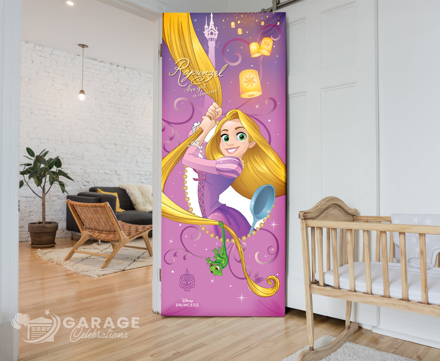 Decorative bedroom door cover with Rapunzel design in a room with a crib and plant.
