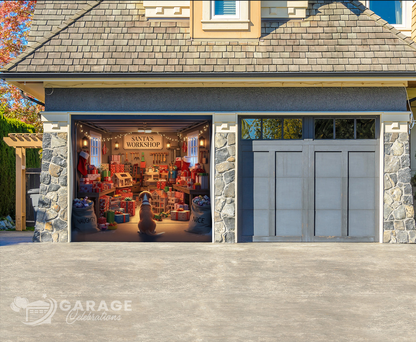 Garage with stone exterior and open door revealing Santa's workshop with gifts and dog in the foreground.