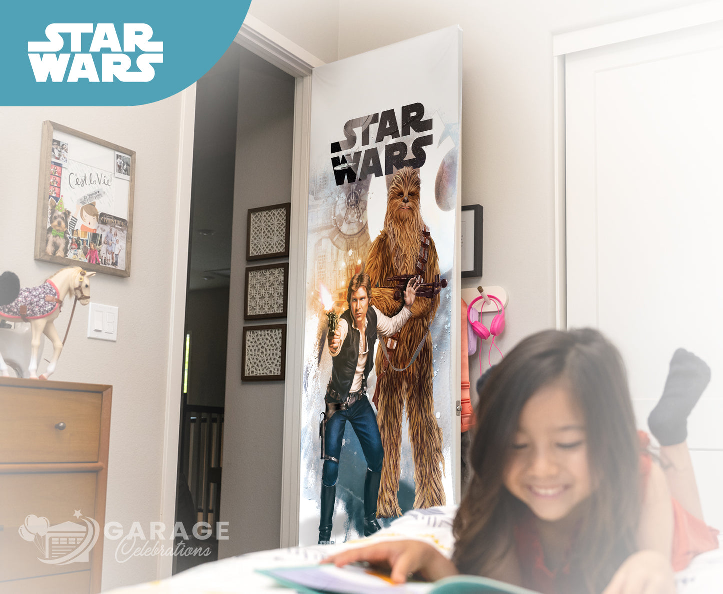 Child reading a book in a room with a Star Wars-themed poster on the wall of Han Solo.
