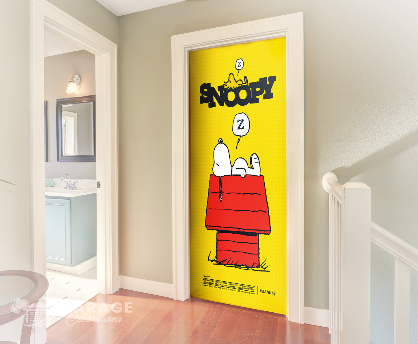 Door with Snoopy and Woodstock design in a room with a bathroom visible.