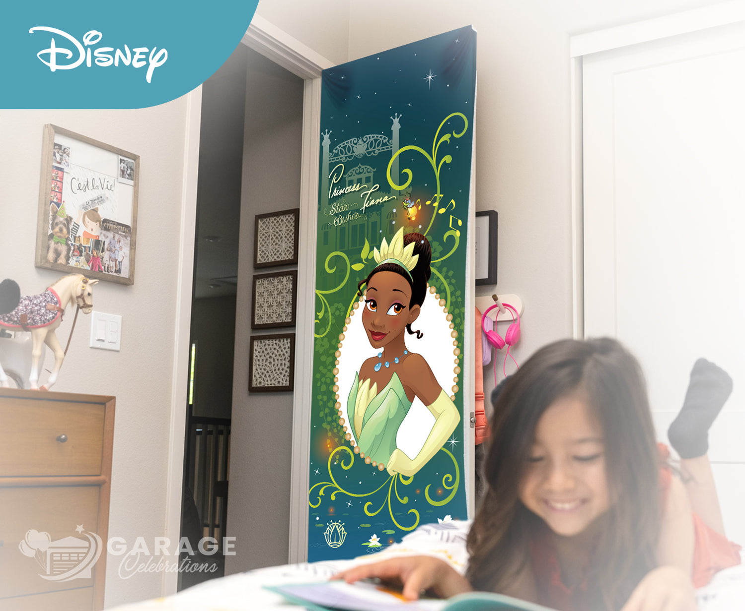 Girl reading a book in front of a decorative door with a Disney Tiana princess design.